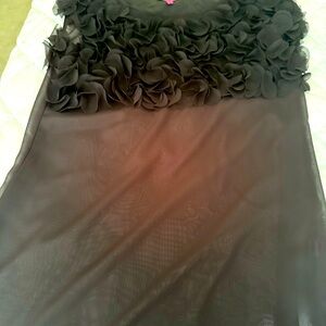Sheer black Rosette ruffle top sleeveless size medium. Great for upcoming season